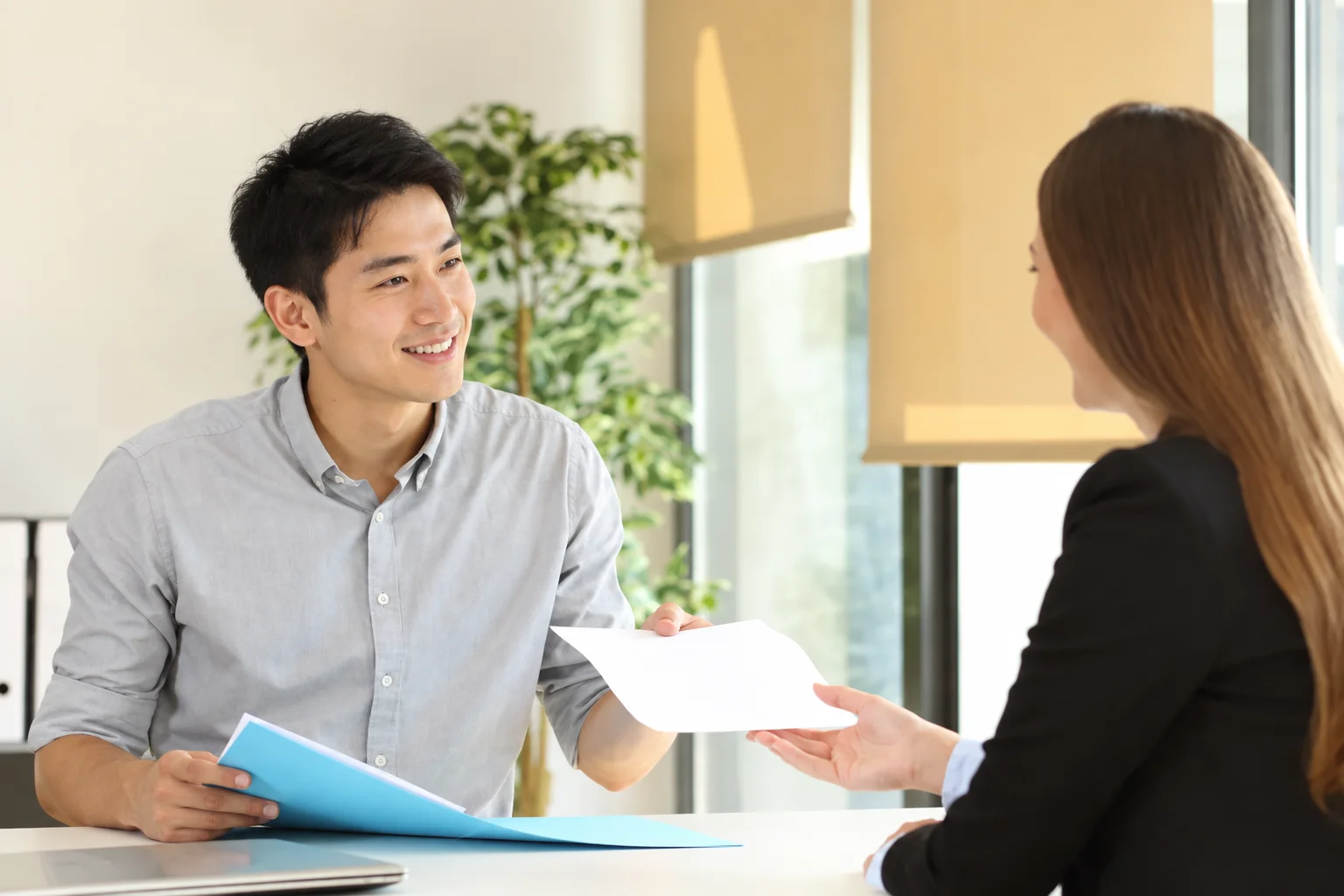 A care coordinator discussing documents with a patient
