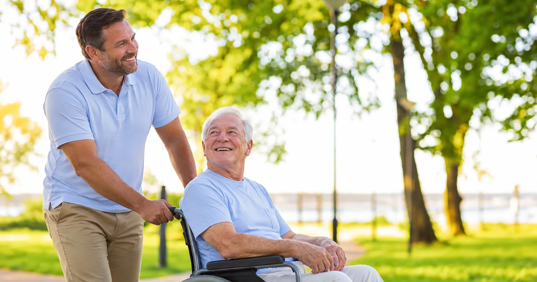 An older man in a wheelchair and a companion enjoying time outdoors
