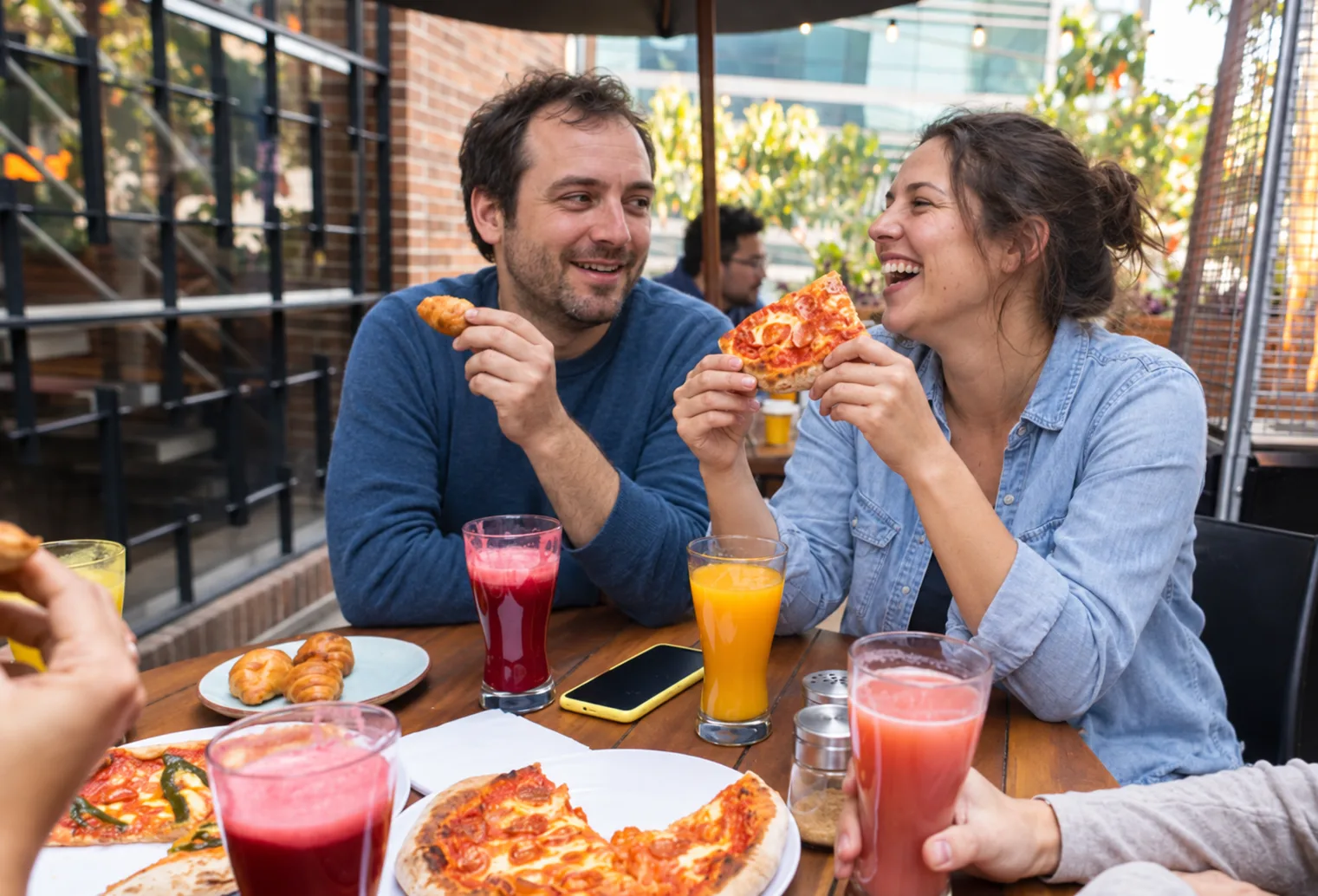 People enjoying a meal together at an outdoor table